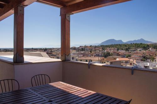 a balcony with a table and chairs and a view at Residenze Branca III SeaView in Orosei
