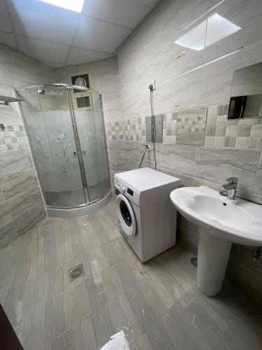 a bathroom with a shower and a sink and a toilet at Private Studio Room in Abu Dhabi