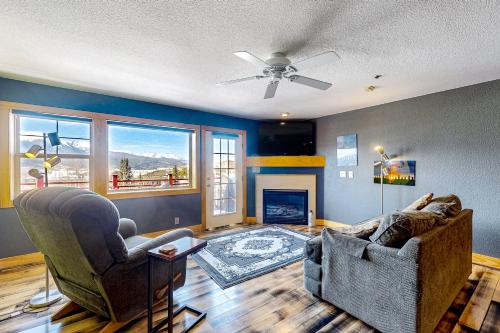 a living room with two chairs and a fireplace at La Rive Del Lago 302 in Dillon