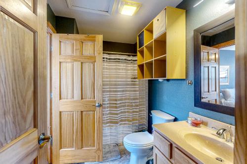 a bathroom with a toilet and a sink at La Rive Del Lago 302 in Dillon