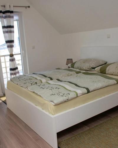Postel nebo postele na pokoji v ubytování Vikendica Jadranka