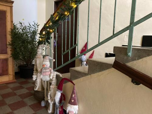 a christmas decoration on the stairs of a house at Apartment In The Garden in Držovice