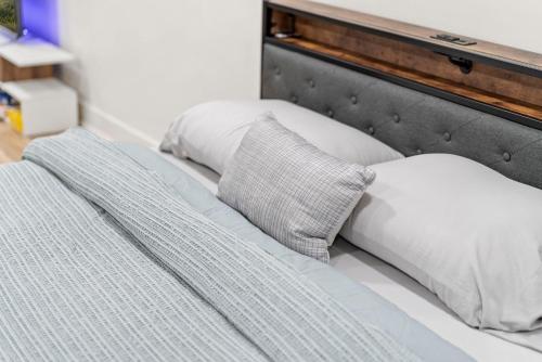 a bed with two pillows on top of it at 10Guests! Parking 1ST FLOOR-Duplex in Fair Lawn