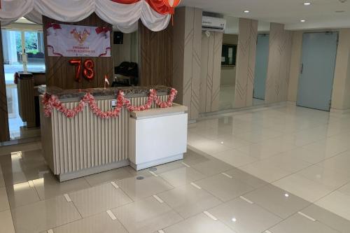 Lobi atau kawasan kaunter penerimaan di Velito at Podomoro Golf View Apartment