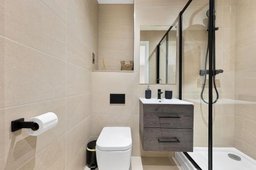 a bathroom with a toilet and a sink and a shower at The Haddon Studio - Apartment 7 in Tideswell