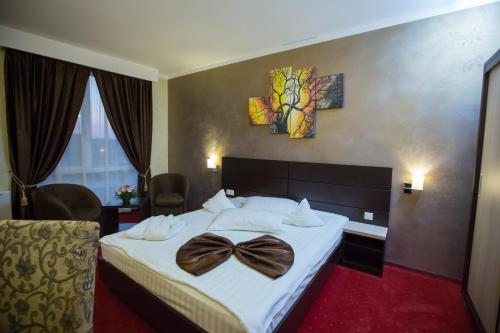 Łóżko lub łóżka w pokoju w obiekcie Hotel Meliss