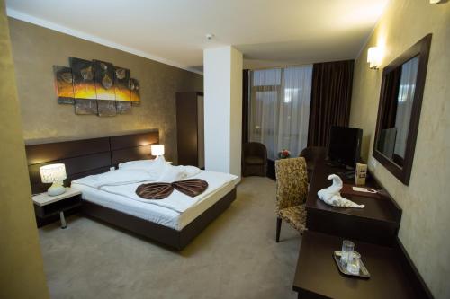 Postel nebo postele na pokoji v ubytování Hotel Meliss