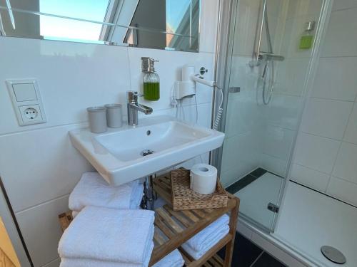 a bathroom with a sink and a shower at Altstadtlage 4 in Stade