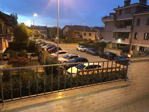 a row of cars parked in a parking lot at Grazioso appartamento a Osteria Nuova in Sala Bolognese