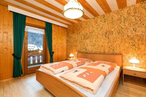 Ένα ή περισσότερα κρεβάτια σε δωμάτιο στο Apartments San Vigilio
