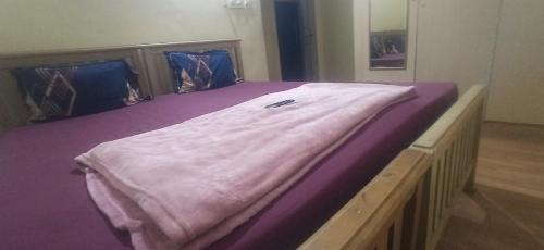 Ένα ή περισσότερα κρεβάτια σε δωμάτιο στο Aditya Heritage Govindapuram