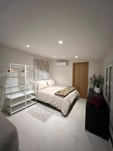 a bedroom with a bed and a book shelf at Lalola villas - Casa privada Denia in Denia