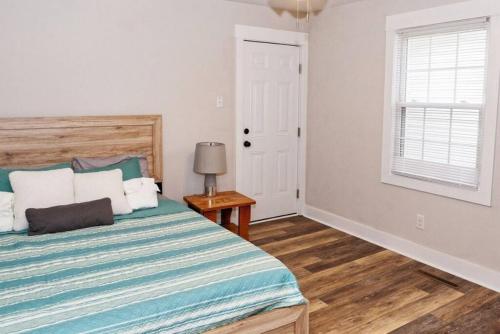 a bedroom with a bed and a window at Newly Renovated Salem Road Ranch in Lincolnton