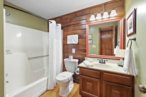 a bathroom with a toilet and a tub and a sink at Quiet cabin in the High Country in Blowing Rock