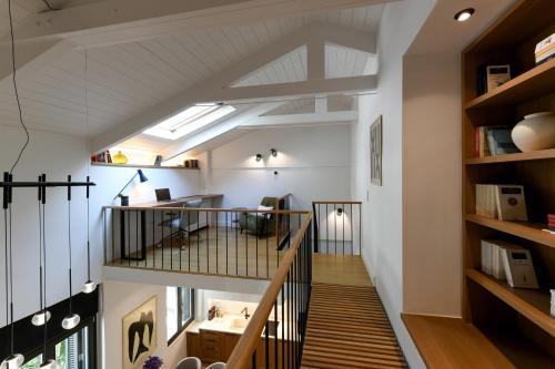 an attic conversion of a house with a staircase and a loft at Boutique Archaeological Museum Suites in Athens