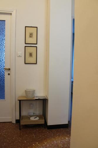 a corner of a room with a table next to a door at Holiday Relax in La Spezia
