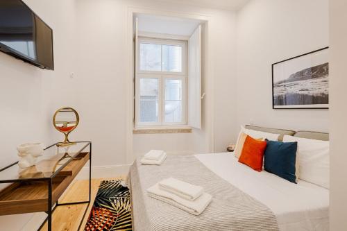 En eller flere senge i et værelse på Architectural Gem in Baixa