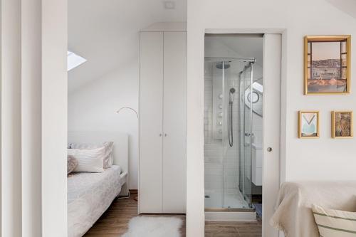 a white bedroom with a shower and a bed at Romantic Gem with 2 Terraces in Alcântara in Lisbon