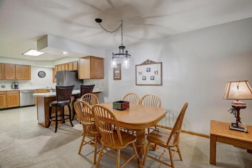 a kitchen and dining room with a table and chairs at Wisconsin Dells Escape - Amazing Views - Pools in Wisconsin Dells