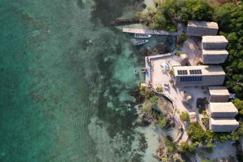 an aerial view of a resort next to the water at Santa Lova Eco-hostel Isla Tintipan in Tintipan Island