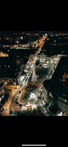 an aerial view of a city at night at FERREIRA'S HOUSE Guimarães in Guimarães