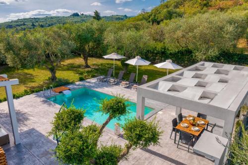 an aerial view of a villa with a swimming pool at Valeria Private Villa in Plános