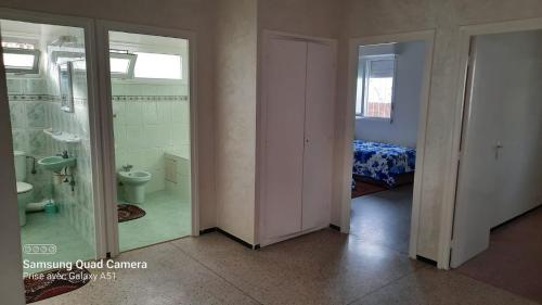 a room with a bathroom with a toilet and a bed at villa agadir in Agadir