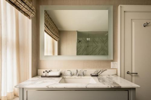 a bathroom with a sink and a mirror at The Manhattan Club in New York