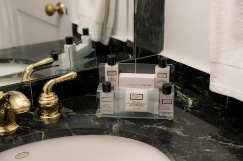 a machine sitting on a counter next to a sink at The Manhattan Club in New York