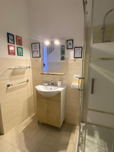 a bathroom with a sink and a shower at Navona "The Corner" in Rome