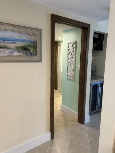 a hallway in a house with a painting on the wall at Beacon Reef 306 in Islamorada