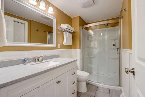 a bathroom with a shower and a sink and a toilet at Destination Dells II at Tamarack Resort in Wisconsin Dells