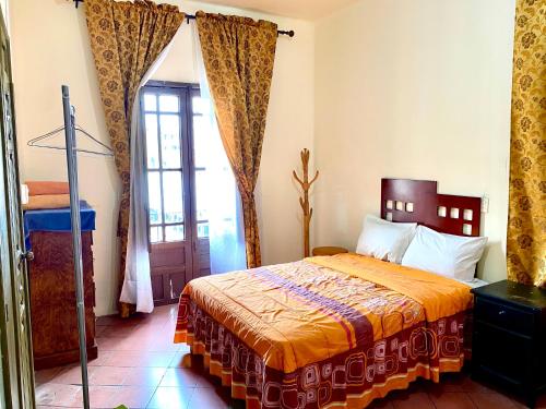 Postel nebo postele na pokoji v ubytování Hostal Santuario de las Libelulas