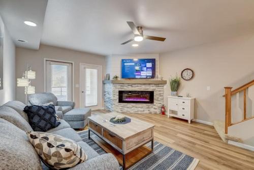 a living room with a couch and a fireplace at Lakefront Luxury for Families or Couples in Wisconsin Dells