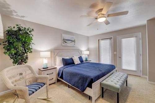 a bedroom with a bed and a ceiling fan at Lakefront Luxury for Families or Couples in Wisconsin Dells