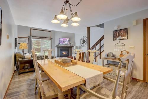 a dining room with a wooden table and chairs at Sloane Condo for Families Golfers and Girls Trips in Wisconsin Dells