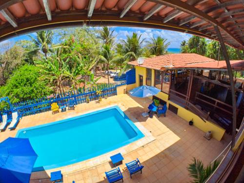 an overhead view of a pool at a resort at Pousada Praia do Amor Pipa in Pipa