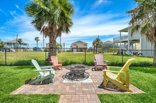 a group of chairs sitting around a fire pit in a yard at Coastal Hourglass in Port Bolivar