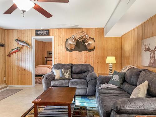 a living room with a couch and a table at Mammoth Overlook Of Yellowstone in Gardiner