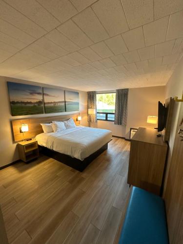 Ένα ή περισσότερα κρεβάτια σε δωμάτιο στο Days Inn by Wyndham Liberty