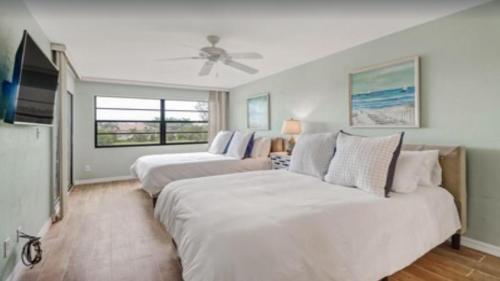 Ένα ή περισσότερα κρεβάτια σε δωμάτιο στο Cozy 1BDRM Condo - Pool Access