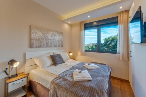 Postel nebo postele na pokoji v ubytování Exclusive Centar Peković