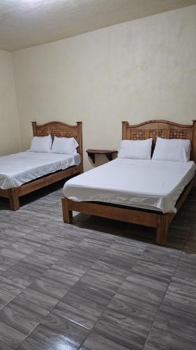 Postel nebo postele na pokoji v ubytování Hotel villas la aurora