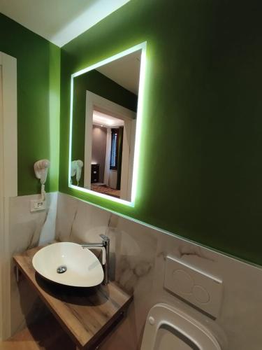a bathroom with a sink and a mirror at Ca' Piasentin in Venice
