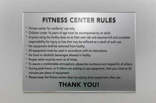 a sign on a wall that says fitness center rules at Uptown, Pool, Wine, Restaurants, BofA Stadium_307 in Charlotte