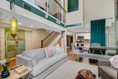 a living room with a couch and a table at The Village Inn by Dakota Gal Digs in Chicago