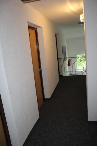 an empty room with two doors and a hallway at Aktivurlaub Morandell in Sölden