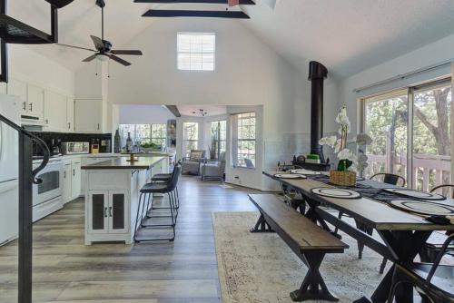 a large kitchen with a wooden table and a dining room at Lake Hm Hideaway - Boat Rental! in Canyon Lake