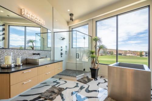 a bathroom with a sink and a large window at Live Luxurious at Zion in Hurricane