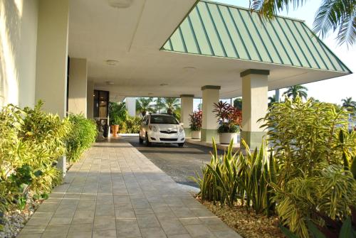 a white car is parked in a building at Floridian Hotel in Homestead